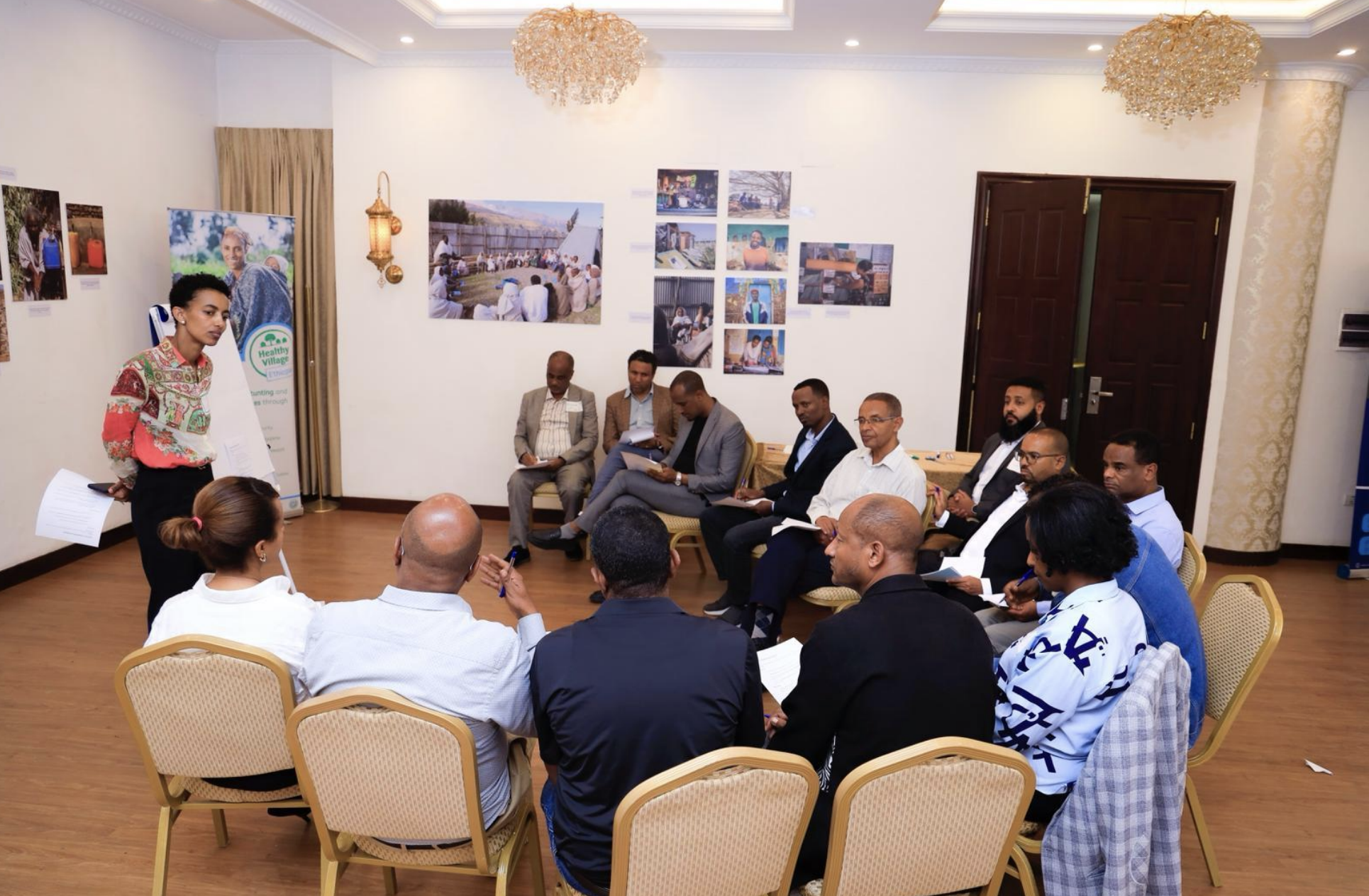 A presenter shares priority actions at a Healthy Village Programme planning workshop