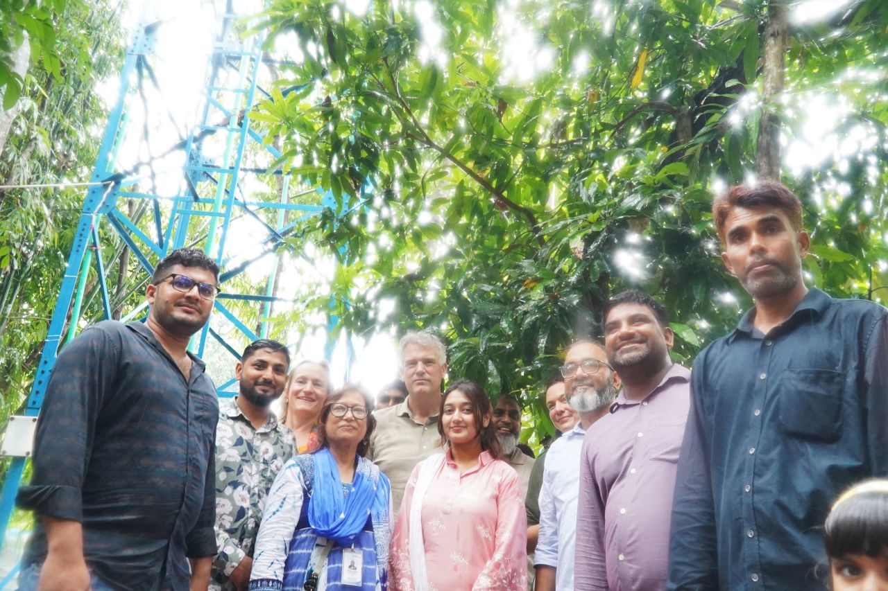 Ambassador Joris van Bommel with Max Social Enterprise colleagues at a Max TapWater tower in Bakerganj, Barishal